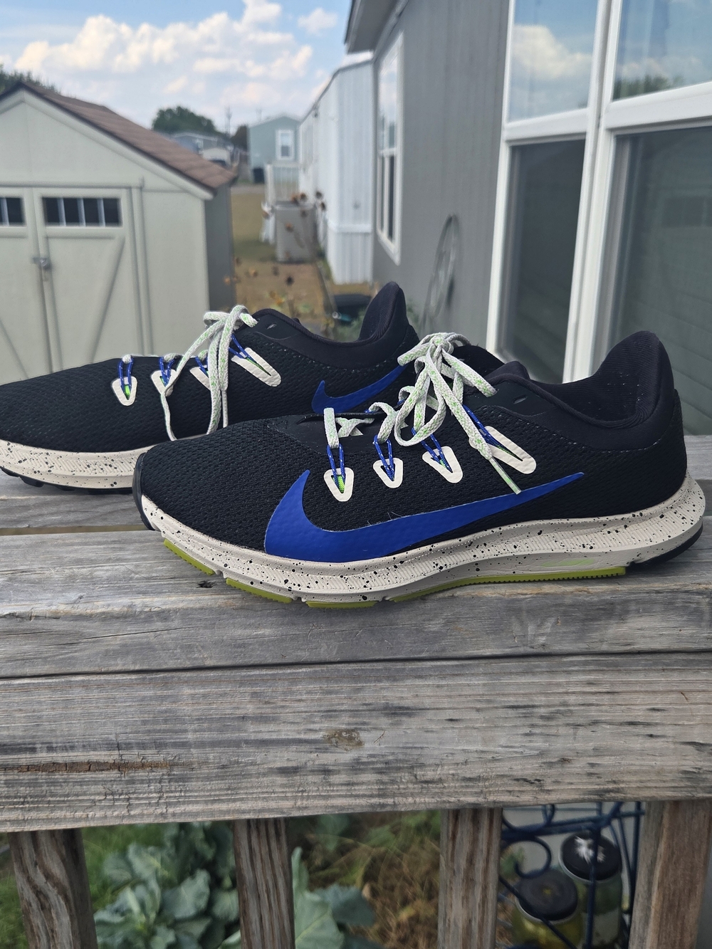 Nike Men’s Black Running Shoes with Blue Swoosh